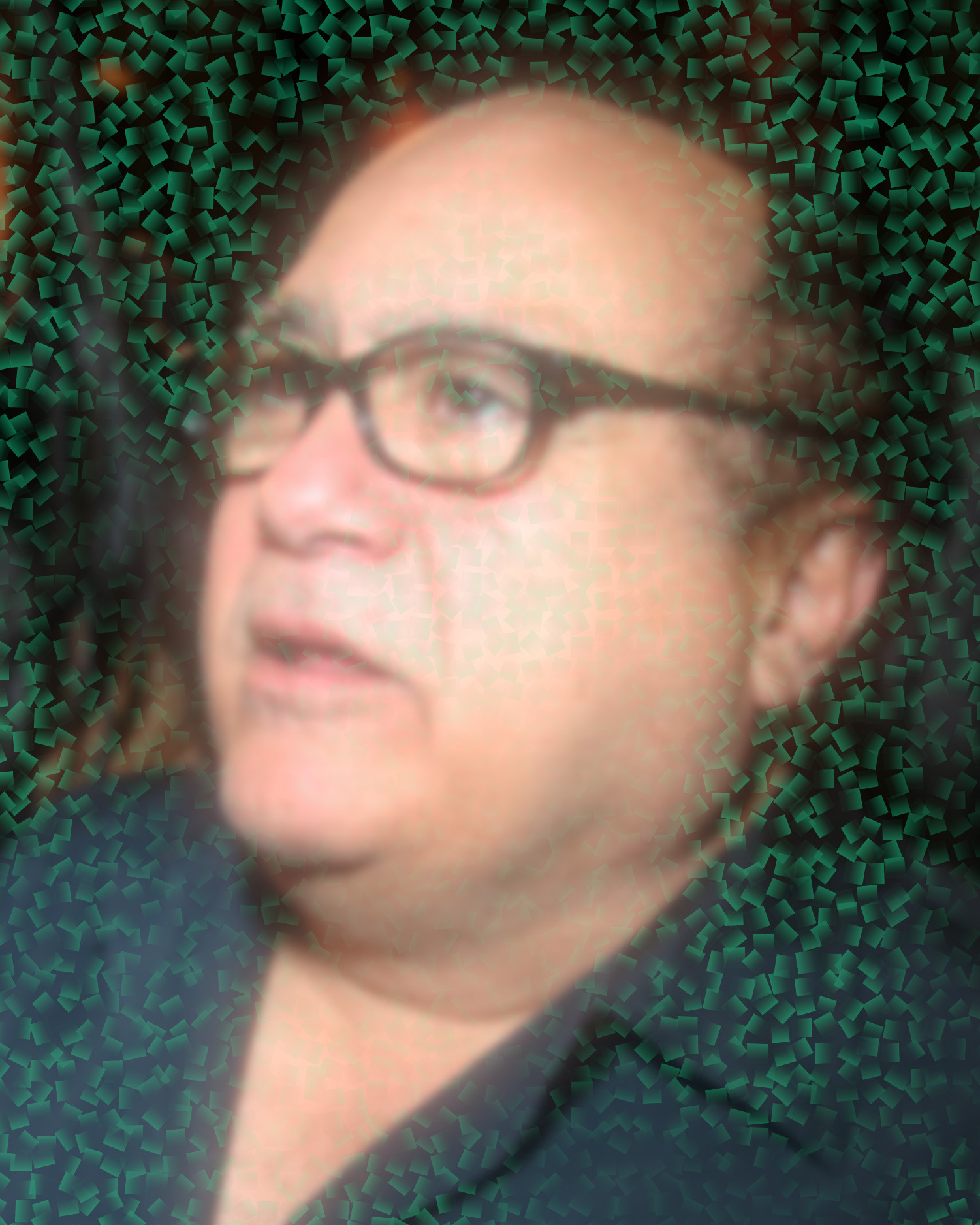 Danny Devito surrounded by cubes