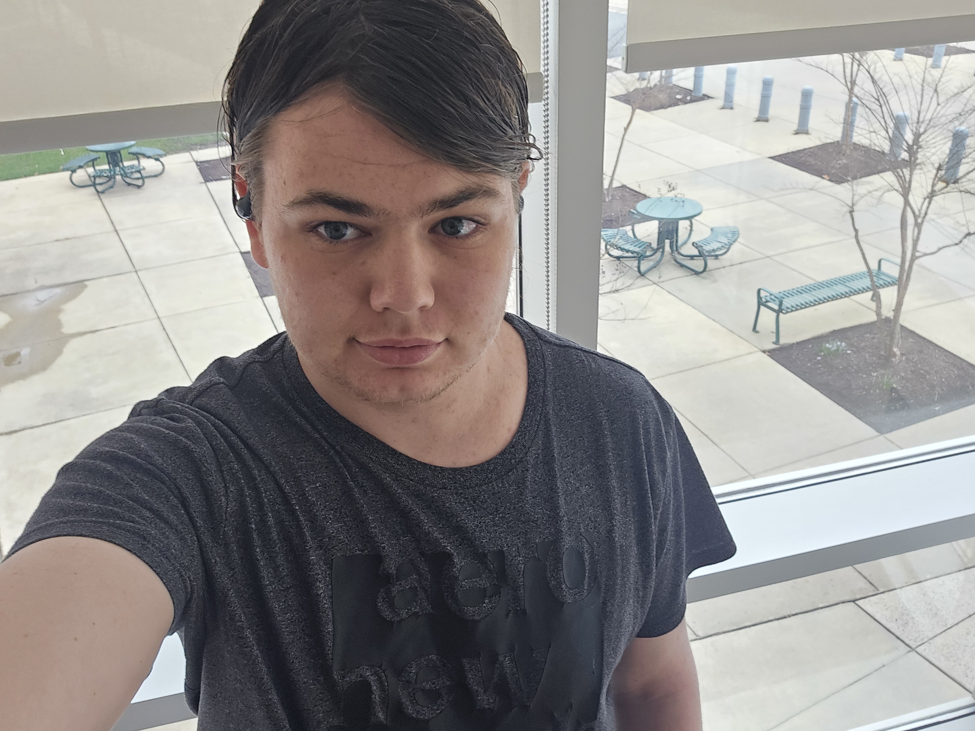 Jonathan Mullins A man standing in front of a window